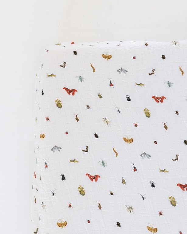 Image of CLEMENTINE KIDS Cotton Muslin Crib Sheet, Cutie Crawlies | Fits standard 52 x 28 x 6 crib mattresses; breathable cotton muslin with elastic corners; machine washable