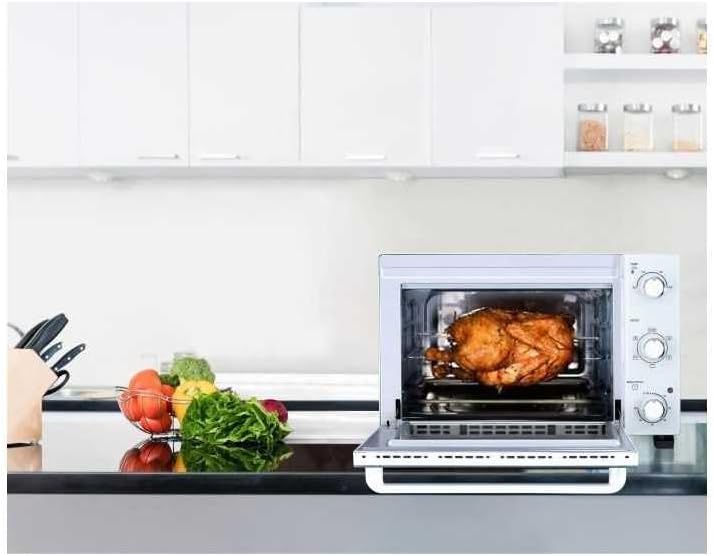 Continental Edison CEMF35W Electric Mini-Oven roasting a chicken in a kitchen setting