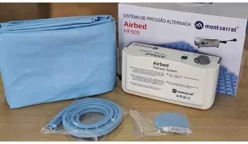 Components of the Genérico Air Plus system laid out: mattress, compressor, and air hoses