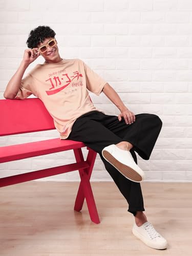 Image of Bewakoof Official Coca Cola Merchandise Men's Graphic Printed Oversized Fit Half Sleeve Round Neck Cotton Jersey T-Shirt