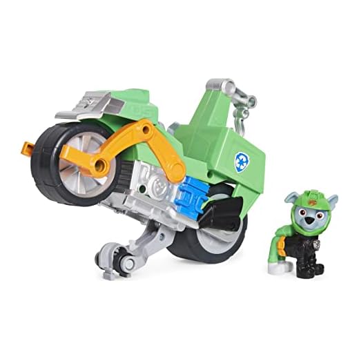 PAW PATROL 6060545 Rocky's Pull Back Motorcykelfordon med Feature and Moto Pups Rocky's Deluxe pull-back-motorcykelfordon med hjulfunktion och figur