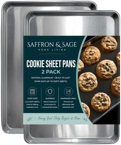 Two bare aluminium half sheet pans with rolled rims, one stacked on the other