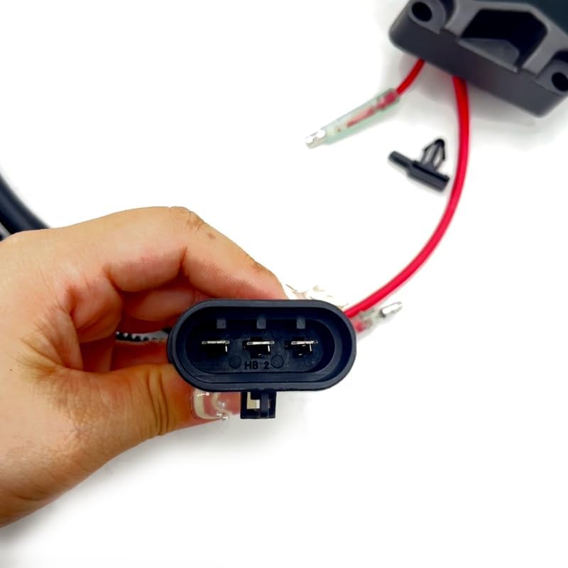 Close-up of a 3-pin electrical connector on the rectifier