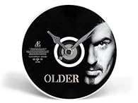 Clock can be wall hung or sat on a desk using the supplied stand. Stand simply fits between the battery and the battery compartment, see photos. A keyring made from the CD booklet can be added. This will be chosen at random, if you would like a parti...