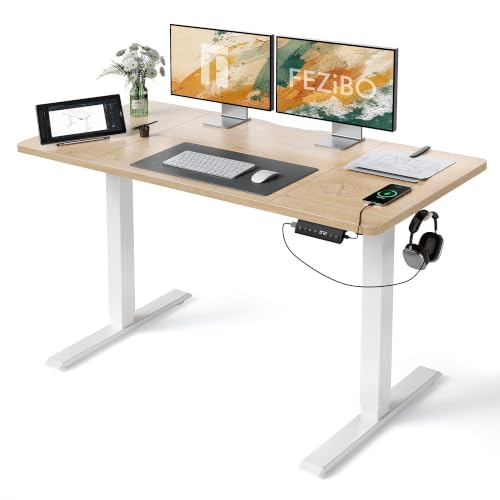 FEZIBO Höhenverstellbarer Schreibtisch mit USB-A und USB-C-Ladeanschlüssen, 140 x 70 cm Schreibtisch Höhenverstellbar Elektrisch, Ergonomischer Steh-Sitz Tisch für Heimbüro, Standing Desk, Eiche
