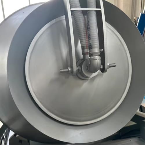 Vacuum meat processor in use showing meat tumbling process