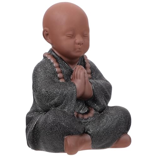 Statue de Bouddha en céramique noire pour apaiser votre espace de travail