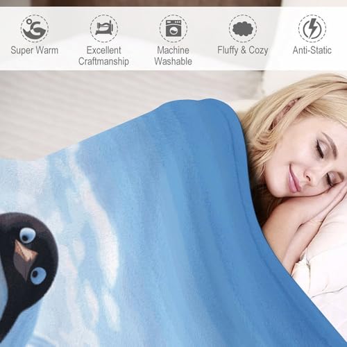 Couverture flanelle pingouin pour soirée cocooning sur le canapé