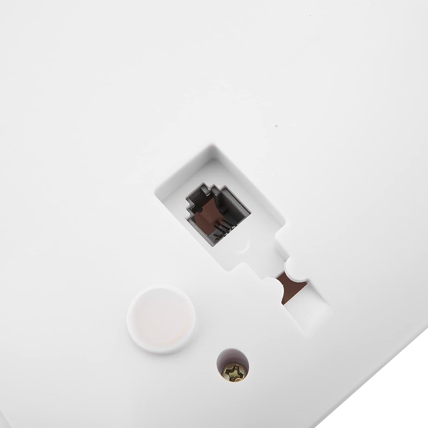 Close-up of the RJ11 telephone line port on the back of the KX-T887 phone