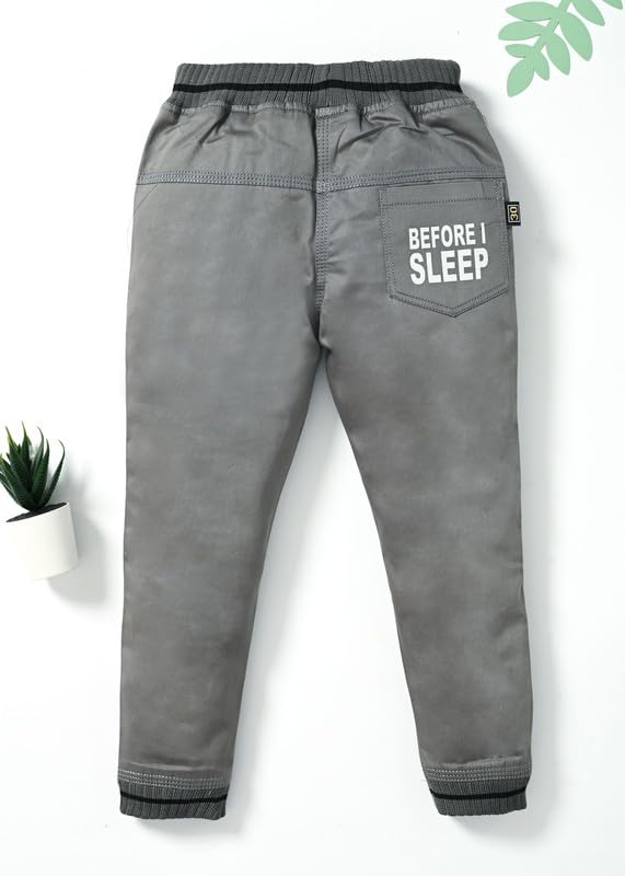 Image of Stylish Printed Joggers with Pockets | Soft Comfortable Elastic Waist Lower | Casual Outdoor Wear Trousers for Daily Use |Pack of 1 Boys Premium Cotton Satin Jeans Cargo Track Pants for Kids 2-7 Years