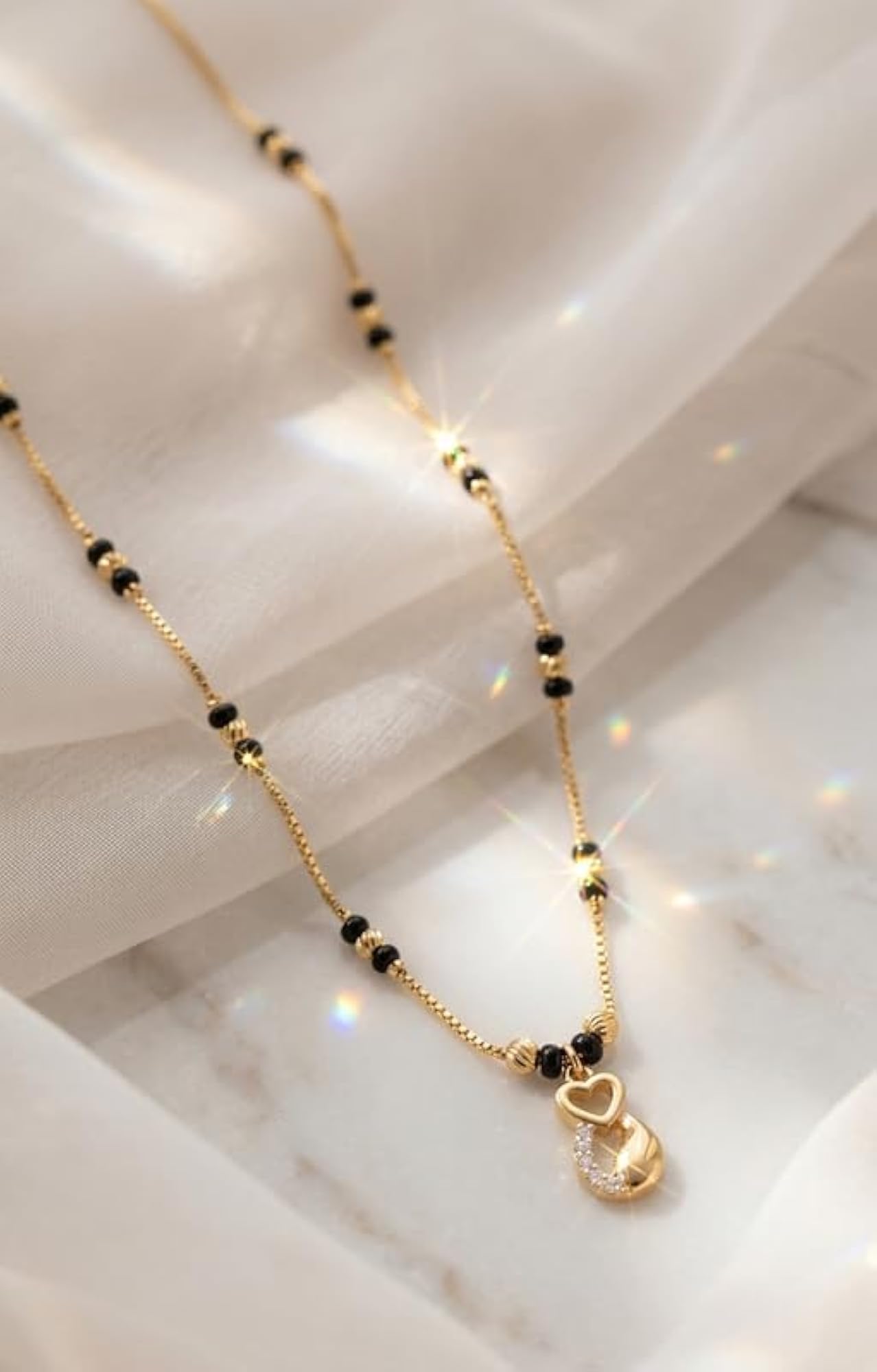 Women's Elegant Gold Heart Mangalsutra with Black Beads