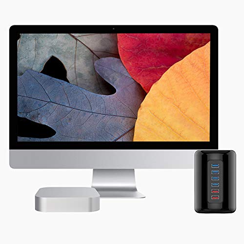 ORICO 4-Port USB 3.0 Cylinder Hub positioned next to an iMac and a Mac Mini, illustrating a typical desktop setup.