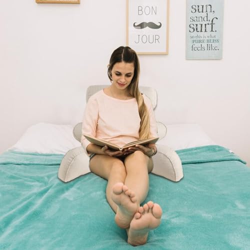 Soutien du dos assis au lit avec cet oreiller pour éviter le mal
