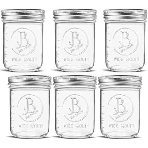 Wide Mouth Mason Jars 16 oz - (6 Pack) - Clear Glass Pint Mason Jars With Airtight Lids and Bands. For Storage, Canning, Fermenting, Meal Prep, Overnight Oats, Freezing, Microwave & Dishwasher Safe Cover
