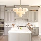 ✨【Design Spoutnik unique】Transformez votre espace de vie avec notre lustre de salle à manger doré du milieu du siècle, une fusion époustouflante de style Spoutnik et d'esthétique contemporaine. Doté d'un long cadre linéaire en laiton et orné de 13 petits abat-jour sphériques en verre blanc laiteux, ce luxueux luminaire de salle à manger moderne respire la simplicité et l'élégance intemporelle.