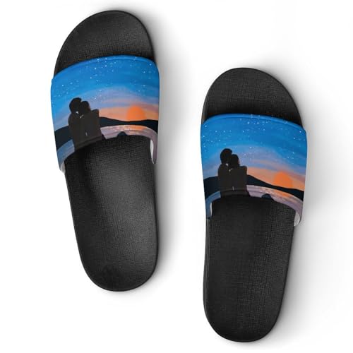Claquettes femme couple contre les chutes au bord de la mer
