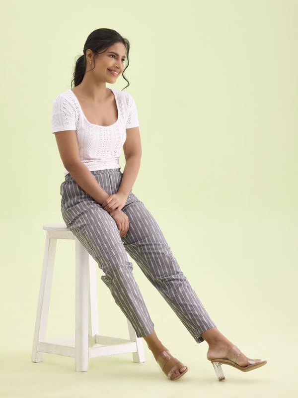 Image of GO COLORS Ikat Print Beige Printed Pencil Pant for Women | Breathable, Side Pocket