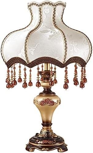 Lampe d'appoint à base sculptée antique pour sécuriser un escalier sombre