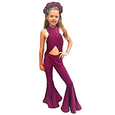 selena in purple jumpsuit