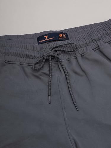 Image of TECHNOSPORT Men's Slim Fit Track Pants with Zip Pockets, ELASTO Plus Quick Dry Stretchable Lightweight Lower for Gym Running Yoga and Sports