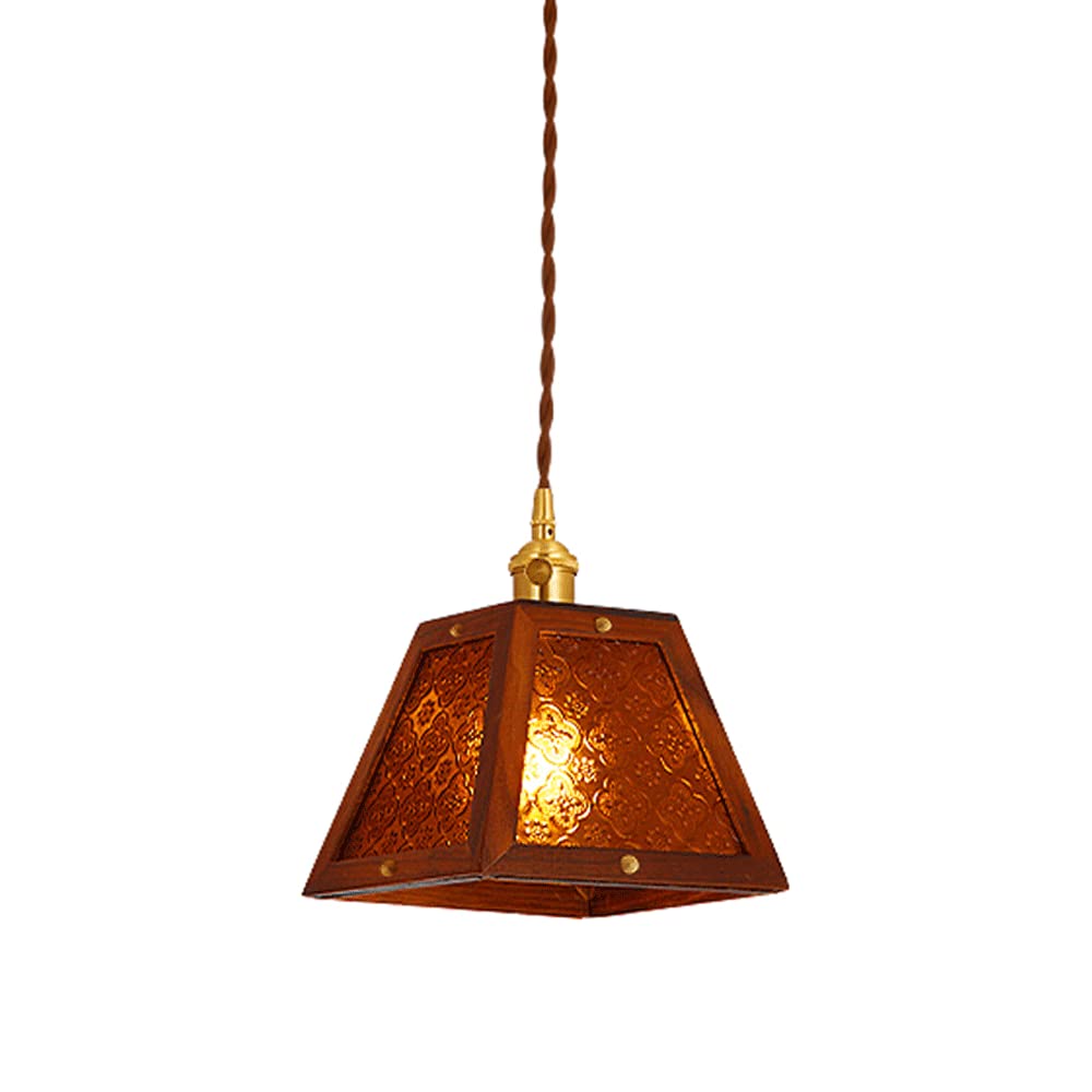 Suspension moderne ambre en vitrail au-dessus de la table pour repas chaleureux