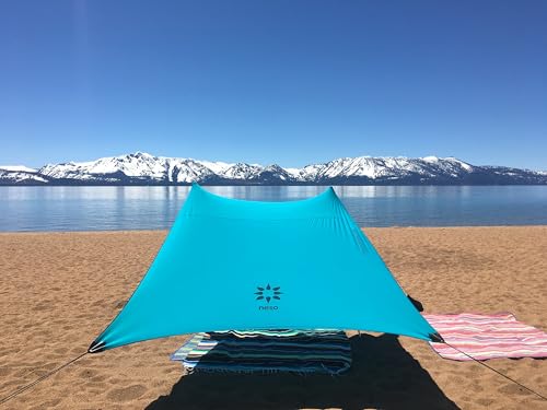Image of Neso Portable Beach Tent Sun Shelter with Sand Anchor - Lightweight Beach Shade Canopy - Easy Setup for Family Outings - Patented Reinforced Corners - UPF 50+ Sun Protection - 7 x 7ft - Teal