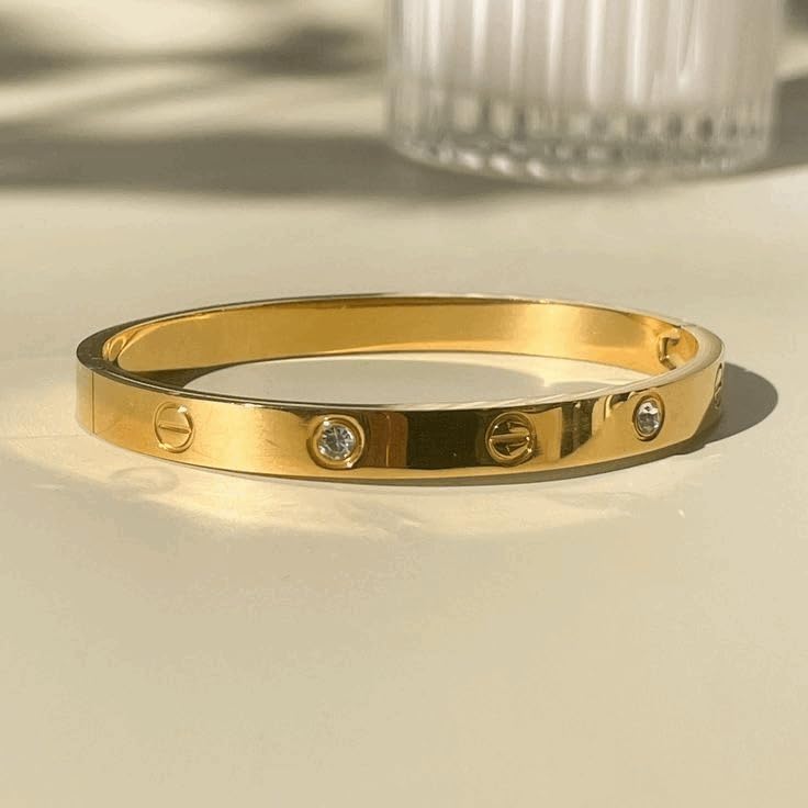 Image of Luxury Gold-Plated Bangle Bracelet with Crystal Accents, Minimalist Design, Screw Pattern Detail