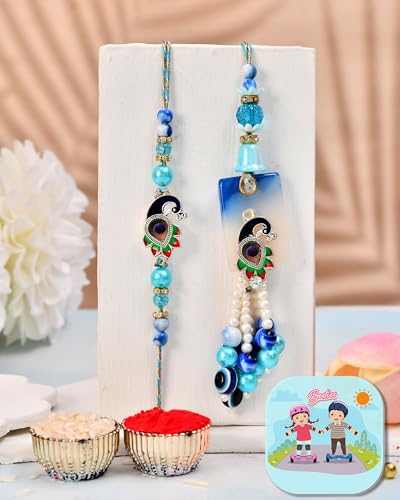Image of CraftVatika Evil Eye Peacock Rakhi Set for Brother and Bhabhi, Designer Rakhi set for Bhaiya Bhabhi Bro Sister, Lumba for Bhabhi, with Fridge Magnet Gift, Best wishes Greeting Card, Tilak