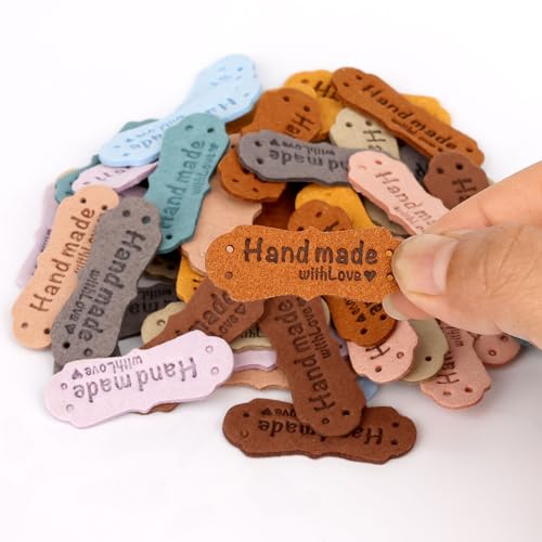 Image of SAVITA 50pcs Handmade Leather Labels, Microfiber Colorful Leather Labels with Love Hearts Handmade Embossed Crochet Tags with Holes for Crafts Knitting Sewing Hats Purses Clothing (10 Colors)