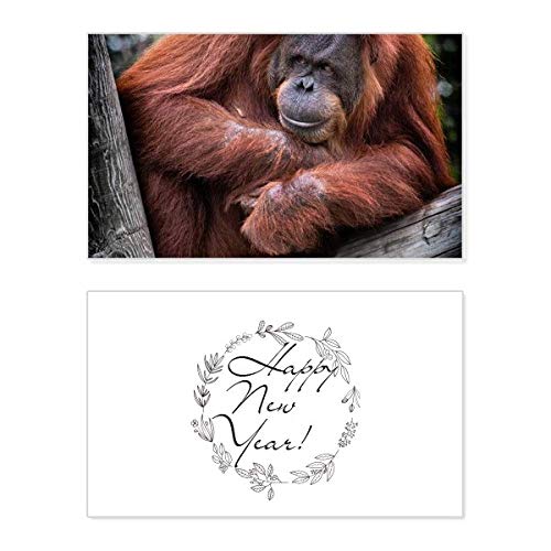 Tarjeta de Año Nuevo de orangután con mensaje de bendición y diseño de animal salvaje terrestre