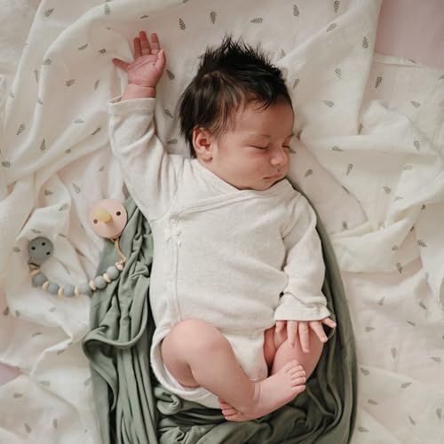 Image of mushie Muslin Baby Swaddle Blanket | 100% Organic Cotton (Leaves)