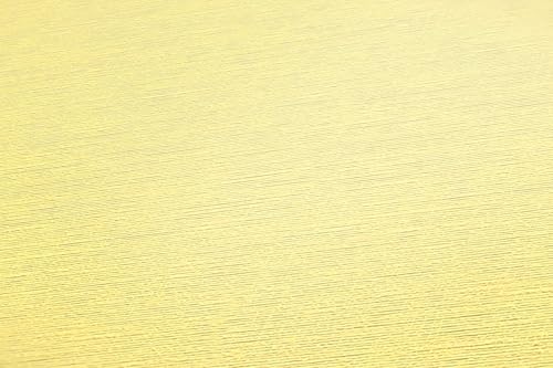 Papier peint intissé jaune Profhome pour masquer les défauts du mur