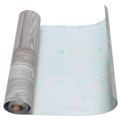 Rouleau de sol PVC autocollant gris pour rénover un carrelage de cuisine usé sans travaux