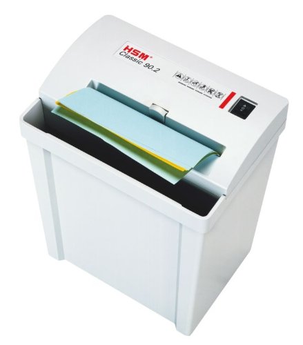 HSM Classic 90.2 paper shredder actively shredding multiple sheets of paper, showing the paper being fed into the slot.