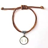 Material: Hergestellt aus braunem Leder und Metall.