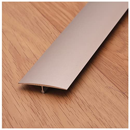 Seuil de porte en T et profilé de transition adhésif or pour jonction parquet carrelage