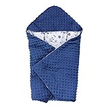 Ein Schlitz zwischen den Beinen und zwei lange Schlitze, mit Klettband verschließbar, zum Durchfädeln von Schulter- und Beckengurten