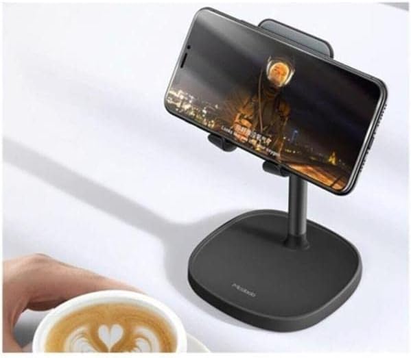 Mcdodo TB-7821 holder with a smartphone in landscape mode, next to a coffee cup.
