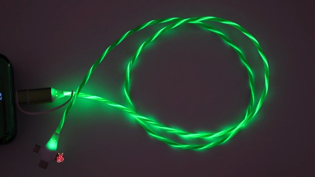 Image of AYI 6-in-1 USB Charging Cable with Green Flowing LED Light, 1m PVC Tangle-Free Universal Sync Cord, Smart Trickle Charging for Phones, Tablets, and More (Cross-Shaped Design).