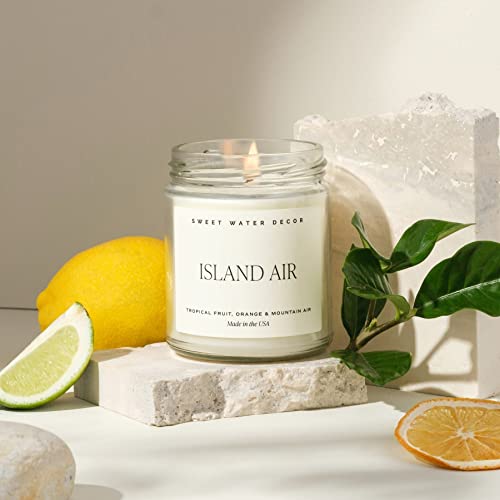 Image of Sweet Water Decor Island Air Candle, 9oz Clear Jar, Tropical Scent | Tropical Fruit, Mountain Air & Orange Scented Soy Wax Candle, Gold Lid, 40+ Hour Burn Time, Poured in USA, Summer Decor