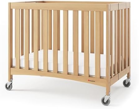 Foundations Travel Sleeper Wood Compact Folding Crib with 2” Infa...