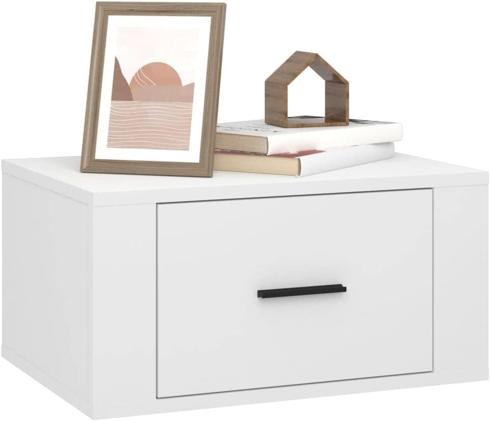 White wall-mounted bedside table with a picture frame, small house figurine, and books on its top surface.