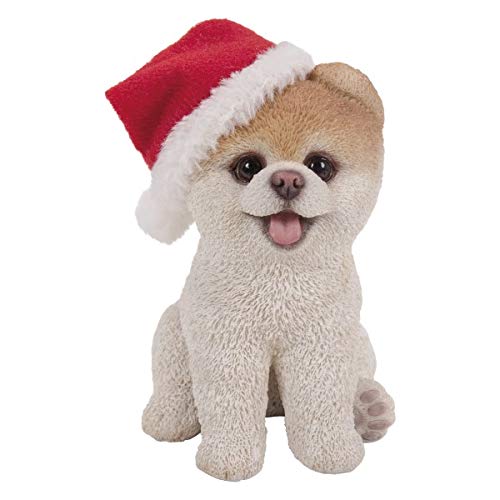 Statuette de Noël en résine et son bonnet de fête pour collectionneur