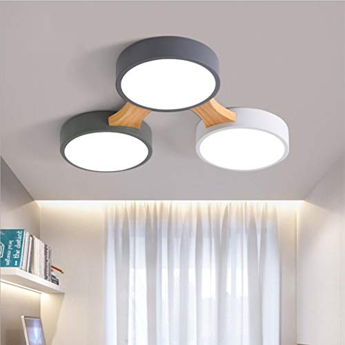 Luminaire macaron 3 têtes pour adoucir l'ambiance lumineuse d'un bureau moderne
