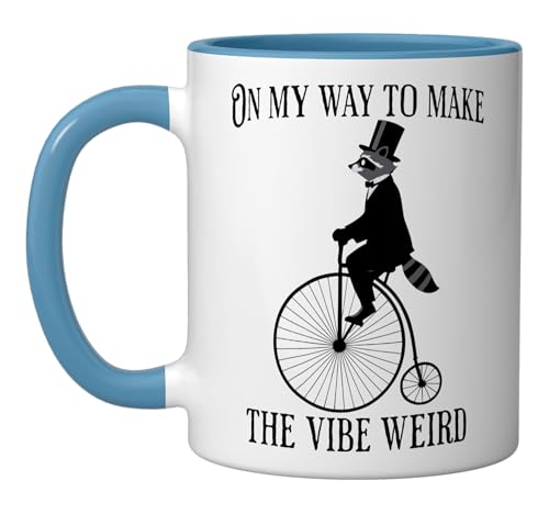On My Way To Make The Vibe Weird, bike riding Raccoon Ceramic Mug, Blue/White
