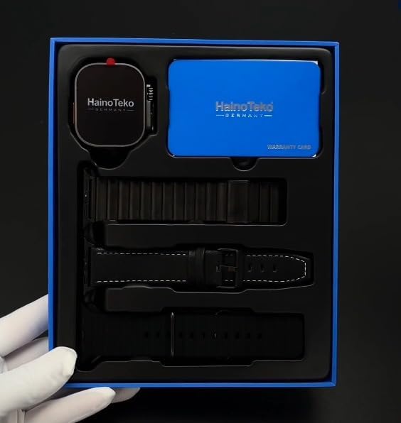 Contents of the Haino Teko-2 Smart Watch package, including the watch, three straps, and a warranty card.