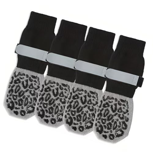 アンチチューストラップ付きの犬の靴下は、木製の床にアクティブなペット用の抵抗性綿のブーティー靴を滑ります。