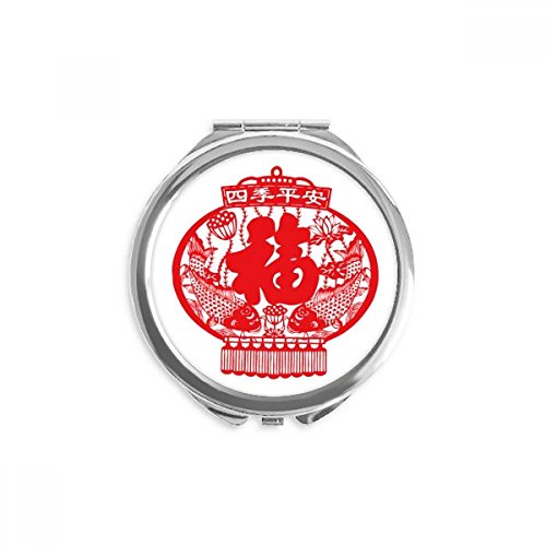Miroir poisson lanterne rouge fini les miroirs lourds avec ce miroir rond de poche compact