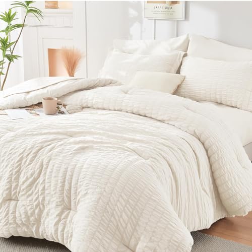 Image of HYMOKEGE Ivory Oversized King Comforter Set Seersucker 7 Pieces, All Season Luxury Bed in a Bag for Bedroom, Bedding Set with Comforter, Sheets, Pillowcases & Shams