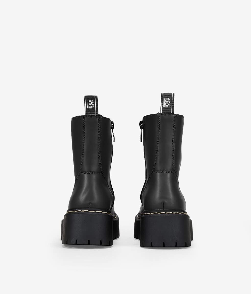 BOSANOVA Bottes militaires style punk fabriquées en cuir vegan avec plateforme dentée et lacets jusqu'au sommet. Fermeture éclair. Chaussures pour femme